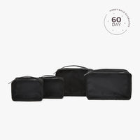 A set of beige packing cubes of various sizes with a white cube labeled '60 DAY'.