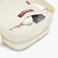 White bag with a headband and card on a white background